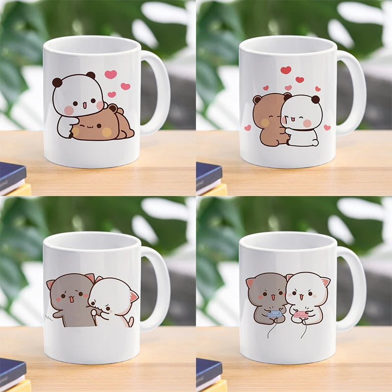 TAZAS DE CAFÉ CON DISEÑO DE OSO Y GATO.